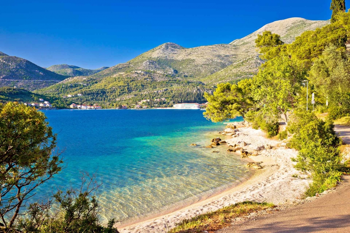 slano beach and trees croatia holidays