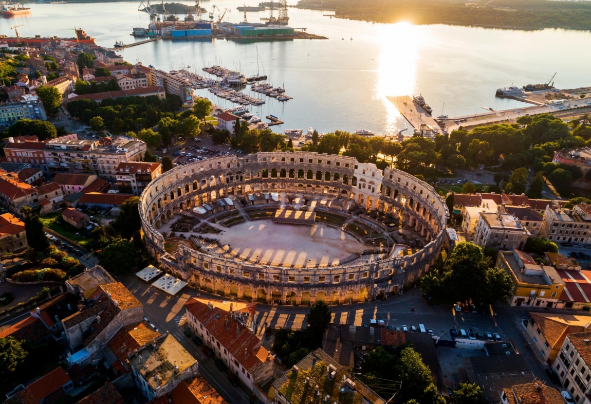 pula coloseum and sun set croatia holidays